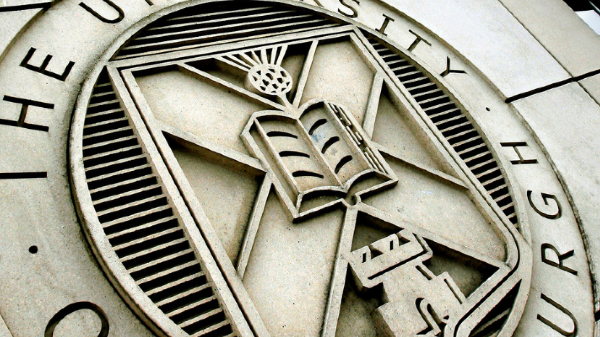 The University's crest carved into the stone at St Leonard's Land