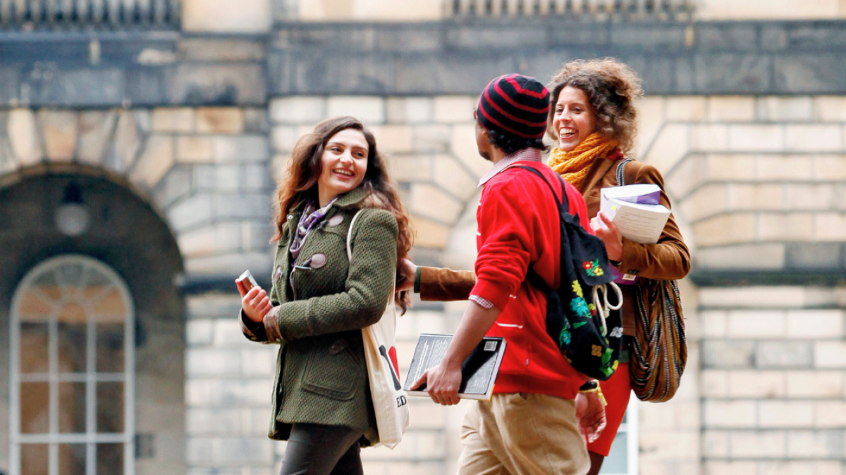 Students walking at Old College