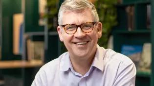 A headshot of Chris Cox