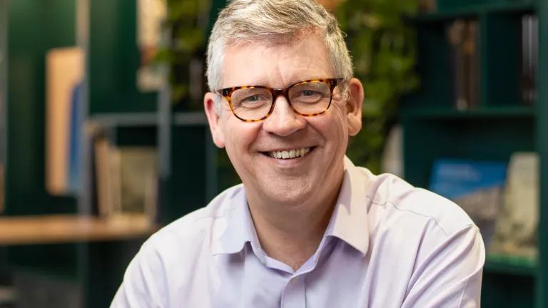 A headshot of Chris Cox