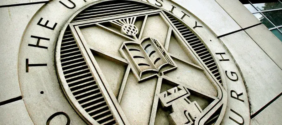 The University's crest carved into the stone at St Leonard's Land