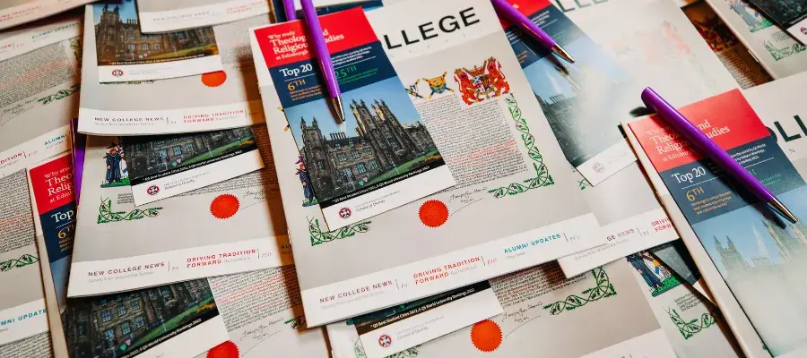 A stack of printed marketing collateral for new and visiting students