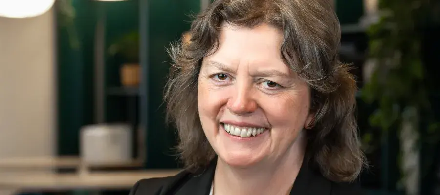 A headshot of Theresa Merrick